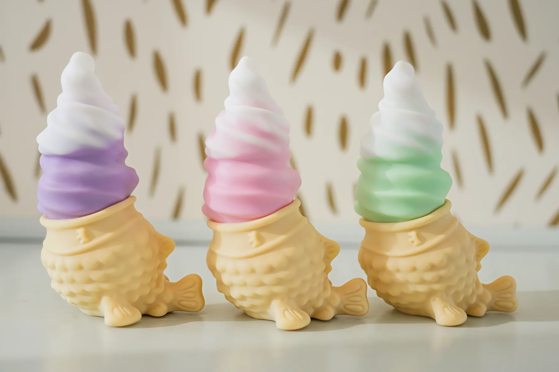 Strawberry, ube and matcha Chai-brator units in a repeating pattern